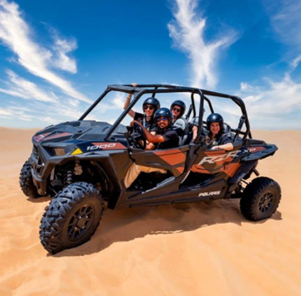 Polaris dune buggy driving in the Dubai desert