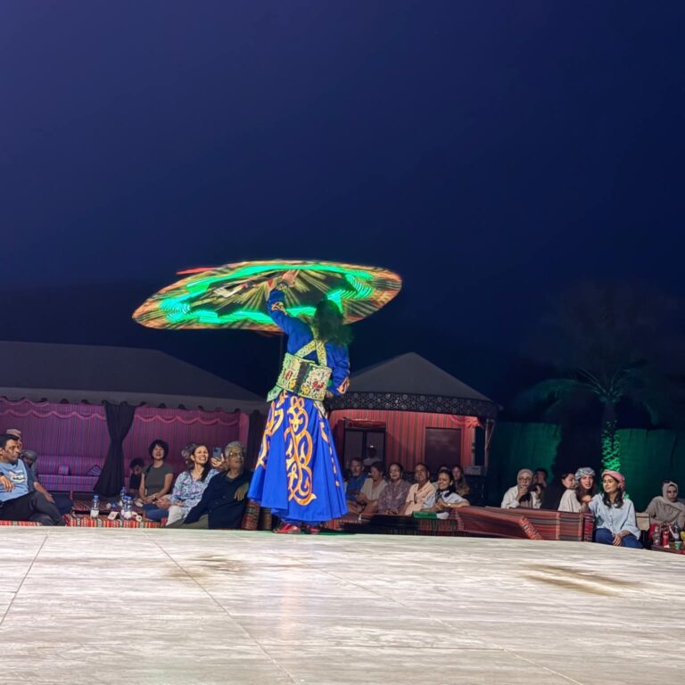 Tanoura dance show at the desert camp at night