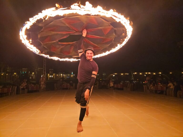 Fire ring show on stage at the desert camp at night